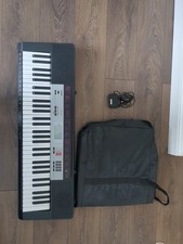 Black Casio CTK-1500 (included with power adapter and case)