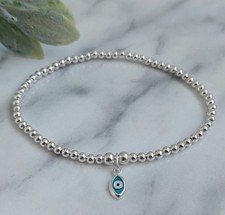 Sterling Silver Bead Elasticated Stretch Bracelet With Mini Evil Eye Charm