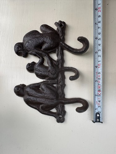 Black cast iron monkey wall - cast,