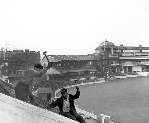 Demolition squads tear - , down