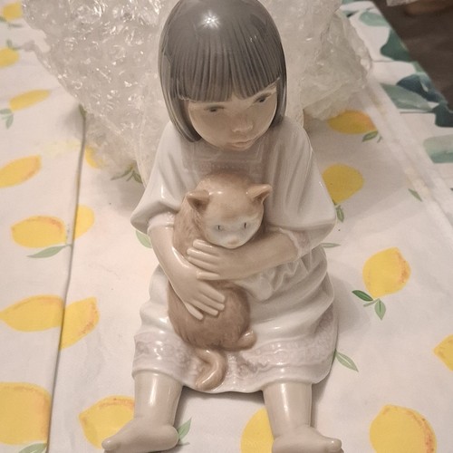 Nao lladro girl hugging - by,