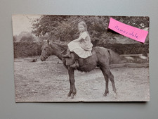 OLD PHOTO GIRL RIDING