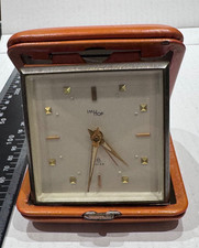 Vintage imhof SWISS TRAVEL CLOCK, IN ORANGE LEATHER . Working -keeps good time