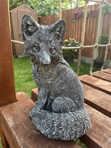 Sitting fox concrete - sitting,