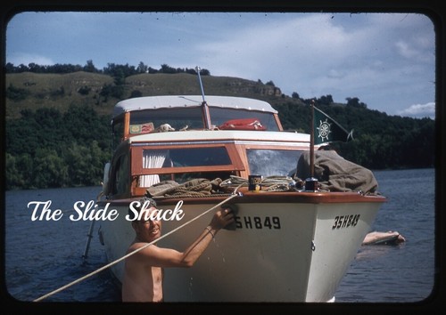 Man scrubbing chris craft boat - man, chris-craft