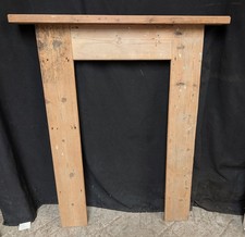 A RECLAIMED PINE FIRE SURROUND