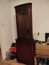 Antique wooden glass corner display cabinet.
