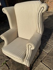Wingback heavy reupholstered studded fabric chair