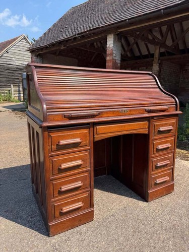 Antique oak roll - top, by
