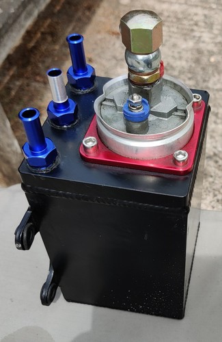 Alloy fuel surge tank with