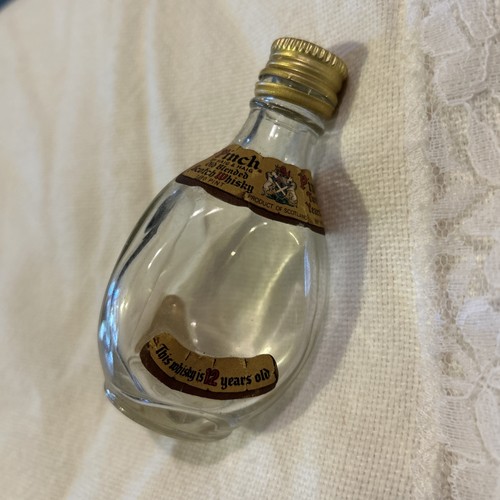 One empty vintage pinch haig - empty,