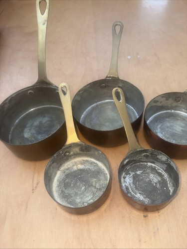 Graduating vintage copper pans - graduating,
