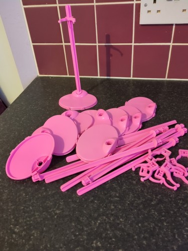 Used pink plastic doll stands - pink,