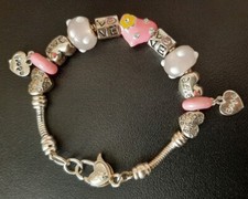 H.Samuel bracelet with 12 beads & charms 7.9" Length comes in box girls bracelet