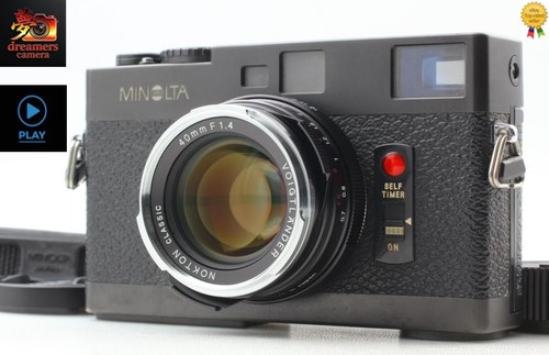 Near mint new lens minolta - mint],