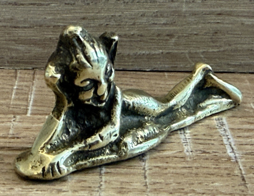 Vintage brass pixi laying - laying, down