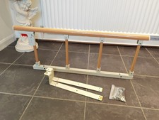 Bed rail safety assist handle