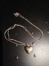 ANTIQUE ROLLED GOLD LOCKET ON