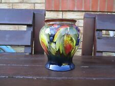 MOORCROFT POTTERY . LEAVES AND BERRY PATTERN FLAMBE VASE