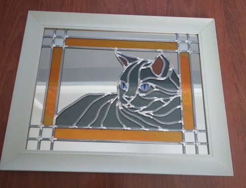 Cat leaded onto mirror - leaded, hand