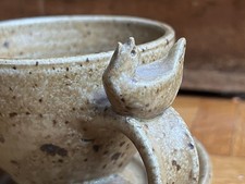 A Fine studio pottery cup and saucer with stylised bird Ian Godfrey style & era