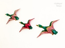 Three Violet Flying Ducks