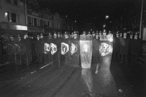 Police officers form wall of - police,