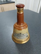 A Vintage Bells Old Scotch Whisky Ceramic Bell Shaped Decanter By Wade.