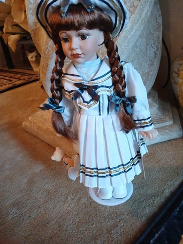 Porcelain dolk by - 18,