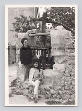 Old B&W Photo To Women Stone