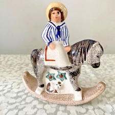 Vintage reproduction of Staffordshire pottery- boy on rocking horse- with cat