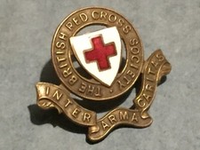 WW2  RED CROSS CAP BADGE . BRASS AND ENAMEL LUGS TO REVERSE.