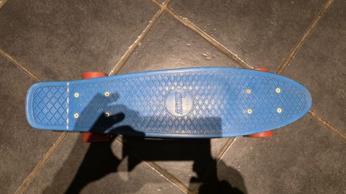 Blue and orange penny - blue, board