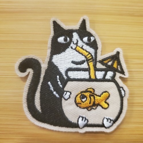 Cat drinking from - from, goldfish