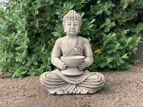 Stone sitting buddha statue