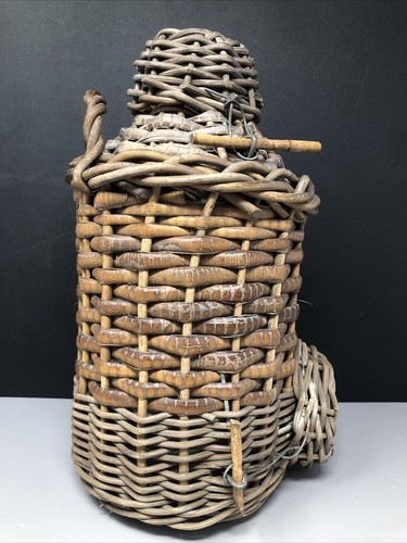 Wicker covered stoneware cider - covered,