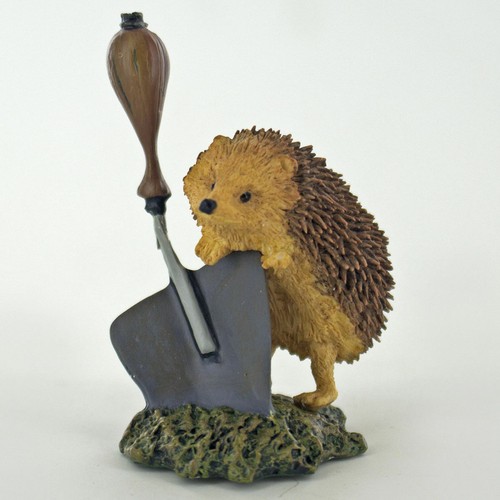 Hedgehog and garden trowel - garden,