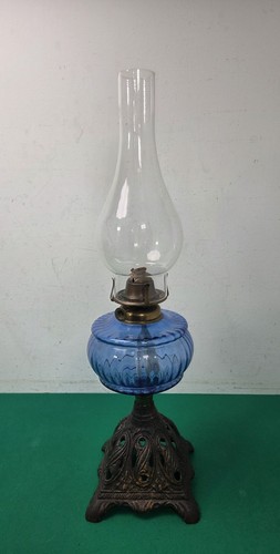 Antique oil lamp with cast - with,