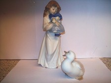 Pair of Nao by Lladro Figurines, #Girl holding Baby 1989 pointing at #Duck 1982