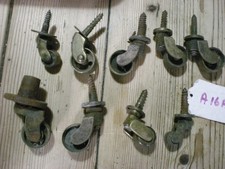 9 ANTIQUE BRASS CASTORS