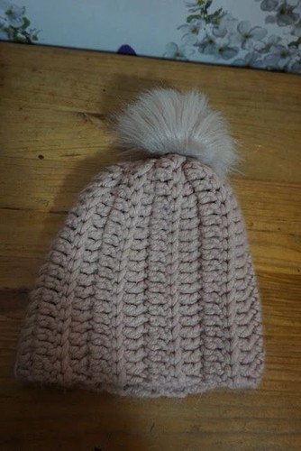 Pink knitted bobble hat