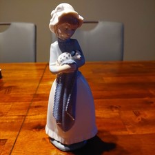 Vintage Nao Girl Holding Puppy