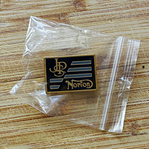 Norton black gold enamel pin - &,