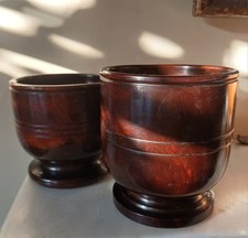 Two lignum vitae turned cups or salts