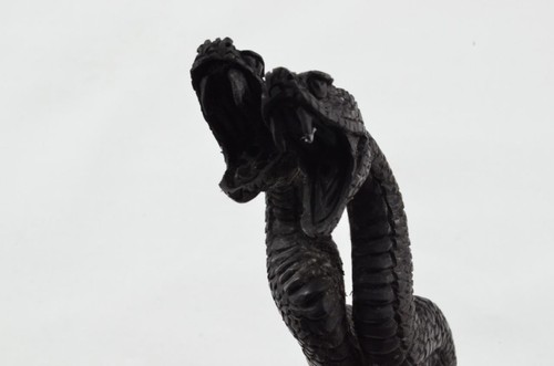 Hand carved snakes - hand,