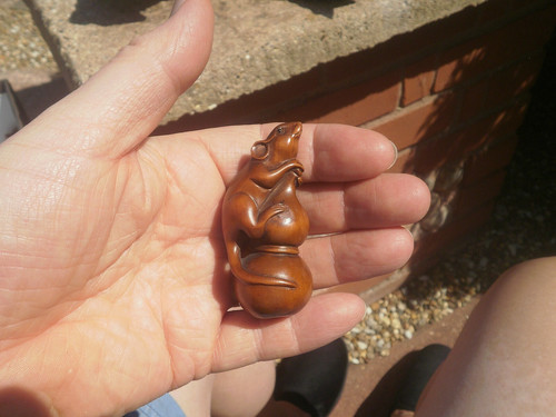 Hand carved wood netsuke - of, a