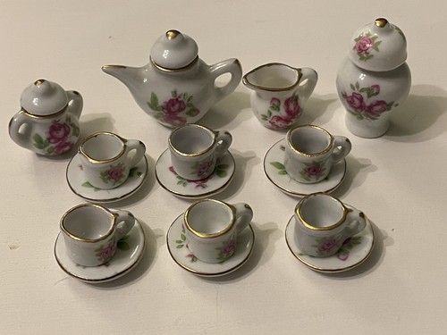 Vintage dolls house - dolls, crockery