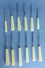 Lot of 12 Faux Ivory / Celluloid Button Hooks