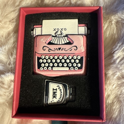 Pink typewriter and - and, black