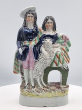 Staffordshire antique figurine group couple with their dog